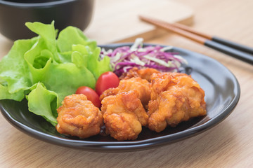 Fried chicken with vegetables on plate, Japanese style