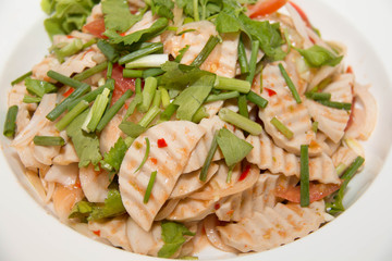 Thai cuisine spicy pork salad on  dish