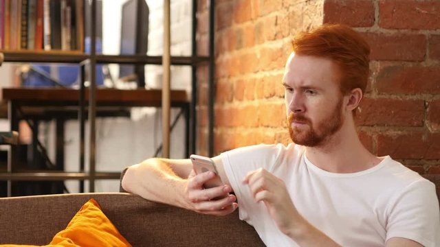 Relax Man Using Smartphone, Sitting on Sofa
