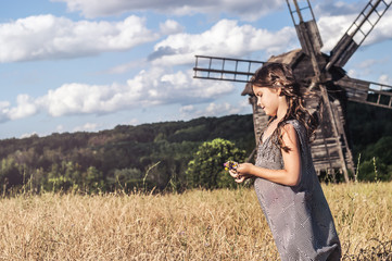 happy little girl in the field
