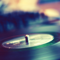 Vinyl record on turntable close-up. Shallow depth of fiels