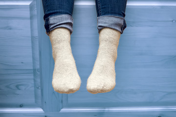 female legs in woolen socks