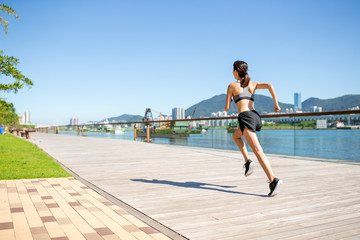 Young woman running at outdoor