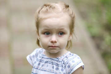Portrait of a little girl on the road in park