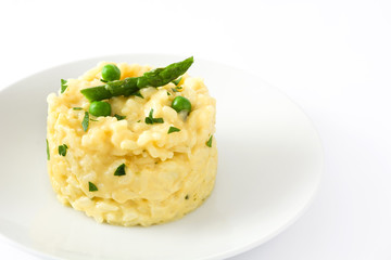 Risotto with peas, asparagus and parsley isolated on white background

