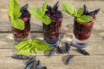 a dessert of ripe berries of a honeysuckle with leaves of mint