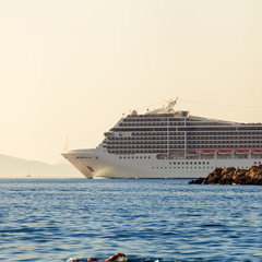 Fototapeta na wymiar Beautiful white cruise liner goes into the sea after a tour of Dubrovnik. Cruise on the Adriatic Sea. Croatia.