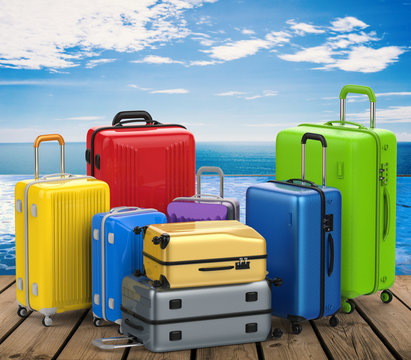 colorful luggages on summer background