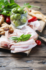 Italian antipasto with chicken ham and bread