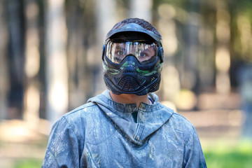 Closeup of young man in paintball mask