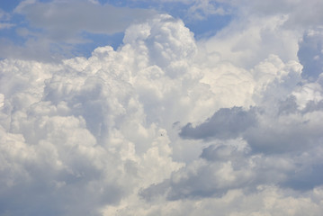 White puffy clouds in the sky.