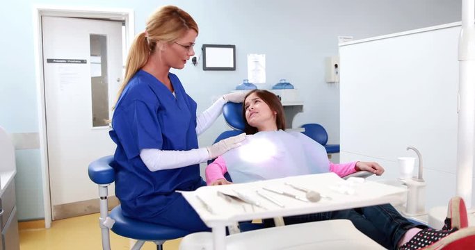 Dentist comforting an afraid child