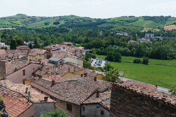 Fototapeta na wymiar landscape with roofs of houses in small tuscan town in province,