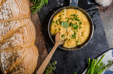 Scrambled eggs in a frying pan