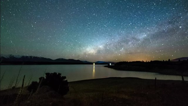 Milky Way Above Lake Pukaki, Beautiful Scene And Reflection. Timelapse Pan Up