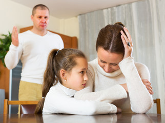 Daughter comforting sad mother