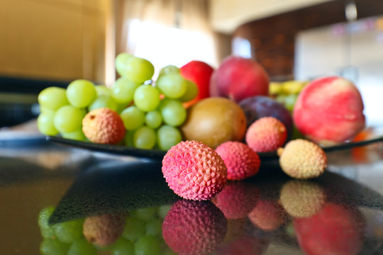 tropical fruits on a kitchen table