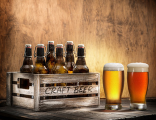 Crafting beer in bottles and glasses.