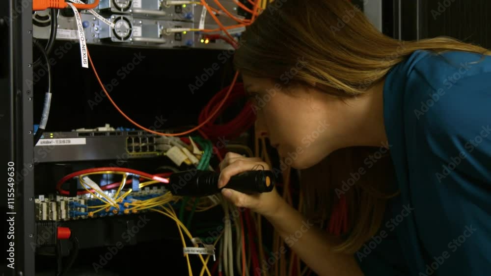 Aufkleber technician looking at open server locker