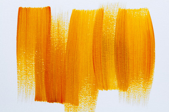 Abstract Orange and yellow Acrylic colors hand paint on white background. 