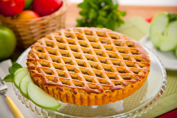 Whole homemade fresh apple pie tart golden crust fruit filled delicious dessert