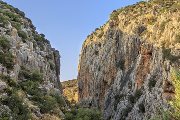 Gorge carved in a rocky mountain by erosion of a watercourse