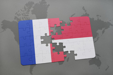 puzzle with the national flag of france and indonesia on a world map background.