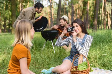 Cheerful young people resting in nature