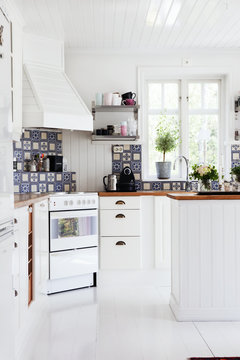 Sweden, Contemporary kitchen with white furniture