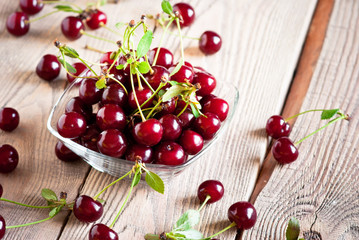 Fresh cherry on wooden table.