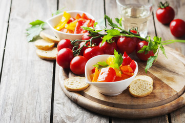 Italian sweet-sour paprika with bread and tomato