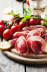 Fresh salami with tomato and bread