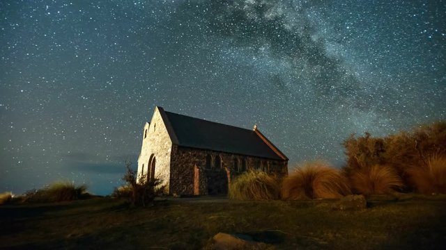Beautiful Milky Way Galaxy Rising Above Church Of Good Shepherd, New Zealand. Timelapse Pan Left Zoom Out
