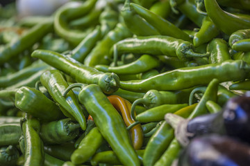 green chili peppers on sale at the market