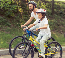 Dad and son cycling