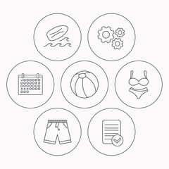 Surfboard, beach ball and trunks icons.