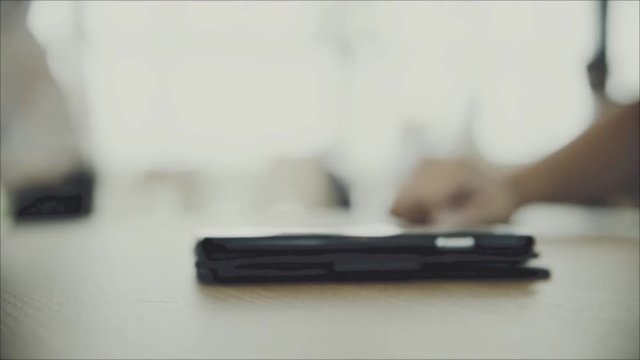 Smartpone put on the wooden table with copy space in the coffee shop HD