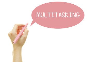 Woman hand writing MULTITASKING with a marker isolated on white.