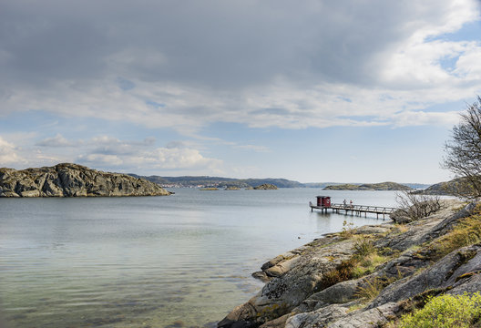 Sweden, West Coast, Bohuslan, Grundsund, Raggardsvik, Bay of water with pier