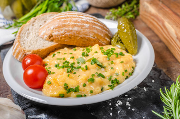 Scrambled eggs in a frying pan