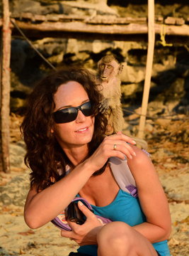 beautiful woman with monkey on back