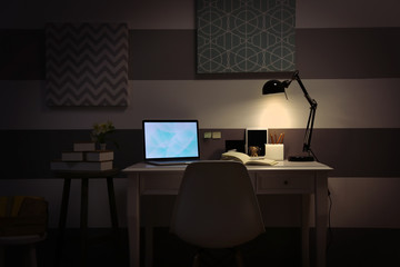 Stylish workplace with laptop at home