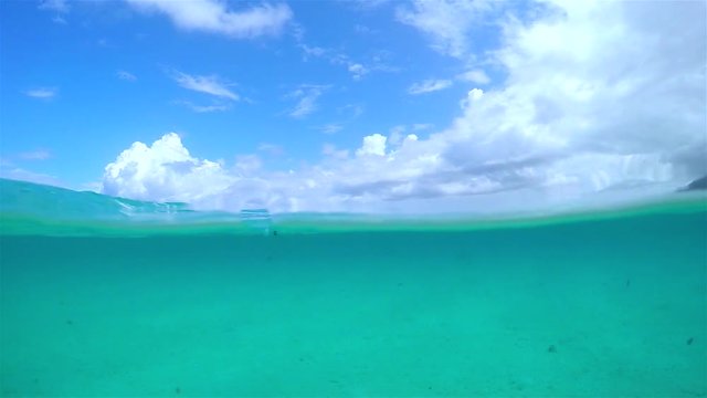 SLOW MOTION UNDERWATER: Lost at sea, swimming in crystal ocean