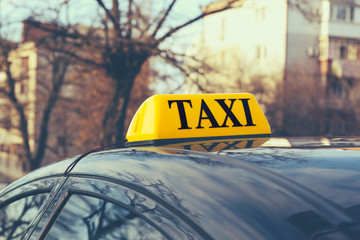 Taxi sign on car, closeup