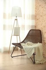 Wicker chair on light wooden parquet