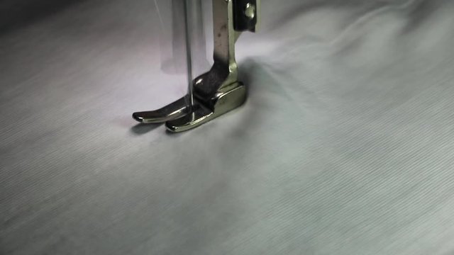 Professional sewing machine with white fabric