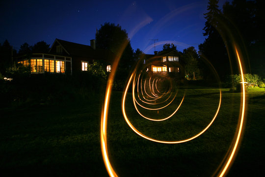 Sweden, Uppland, Loparo, View of spiral light trail in back yard