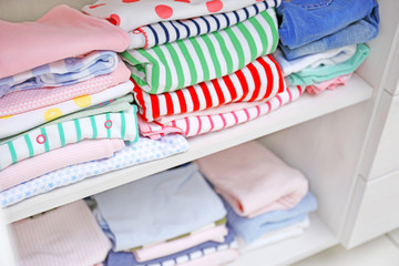 Clothes for kids on shelves