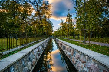 A colorful sunset reflecting in a canal at Kadrioru Park, in Tal