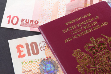 British EU Biometric Passport with ten Euro and Ten pound notes - illustrative editorial